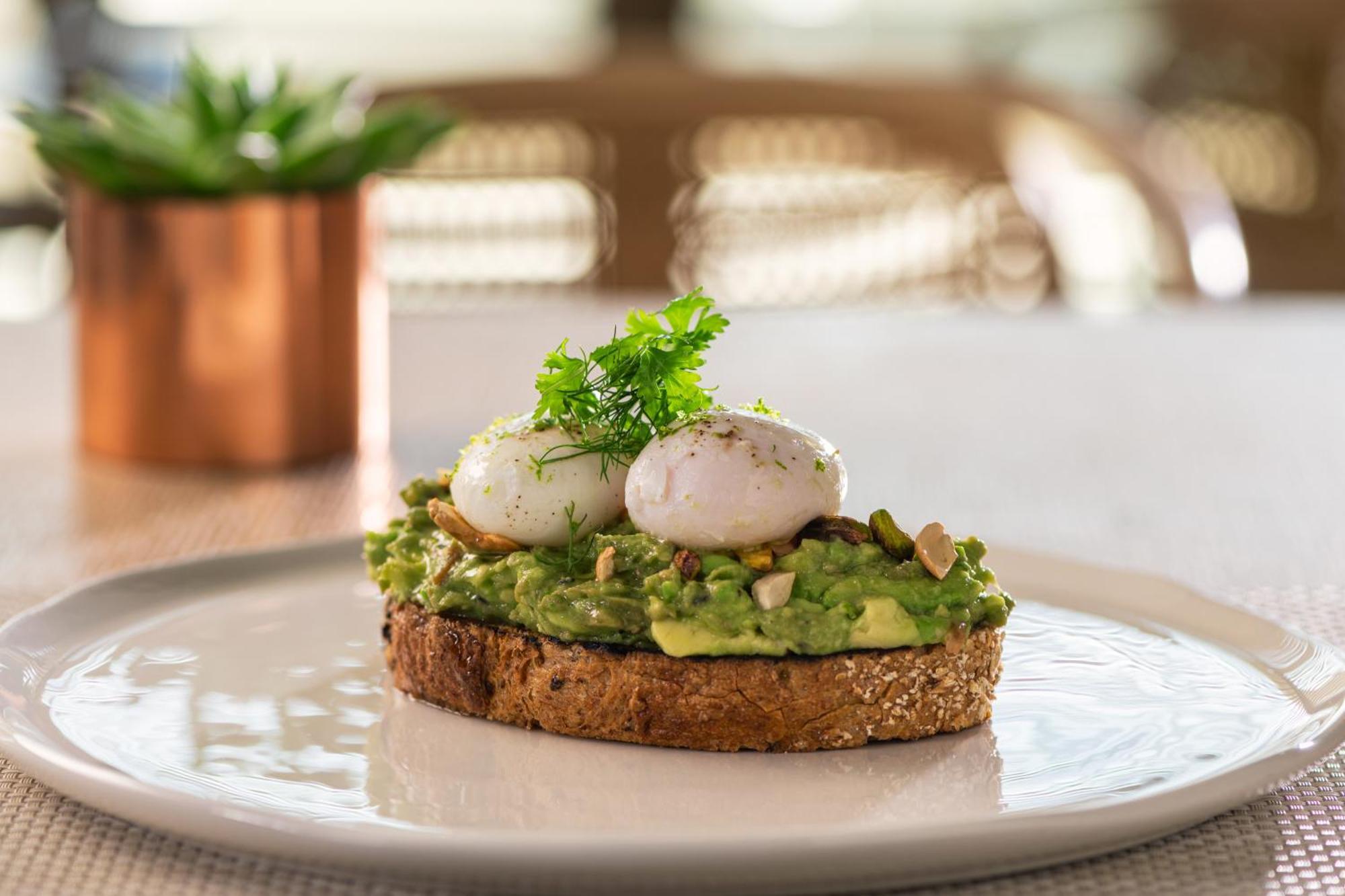 The Abu Dhabi Edition Екстер'єр фото Avocado on toast with poached eggs